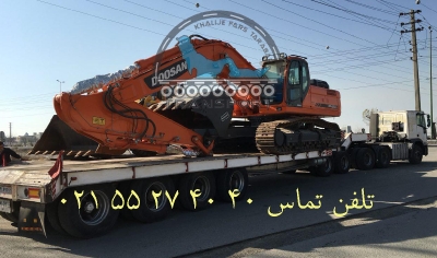 حمل بیل مکانیکی DOOSAN توسط کمرشکن 9 محور ویژه شرکت حمل و نقل خلیج فارس ترابر  
